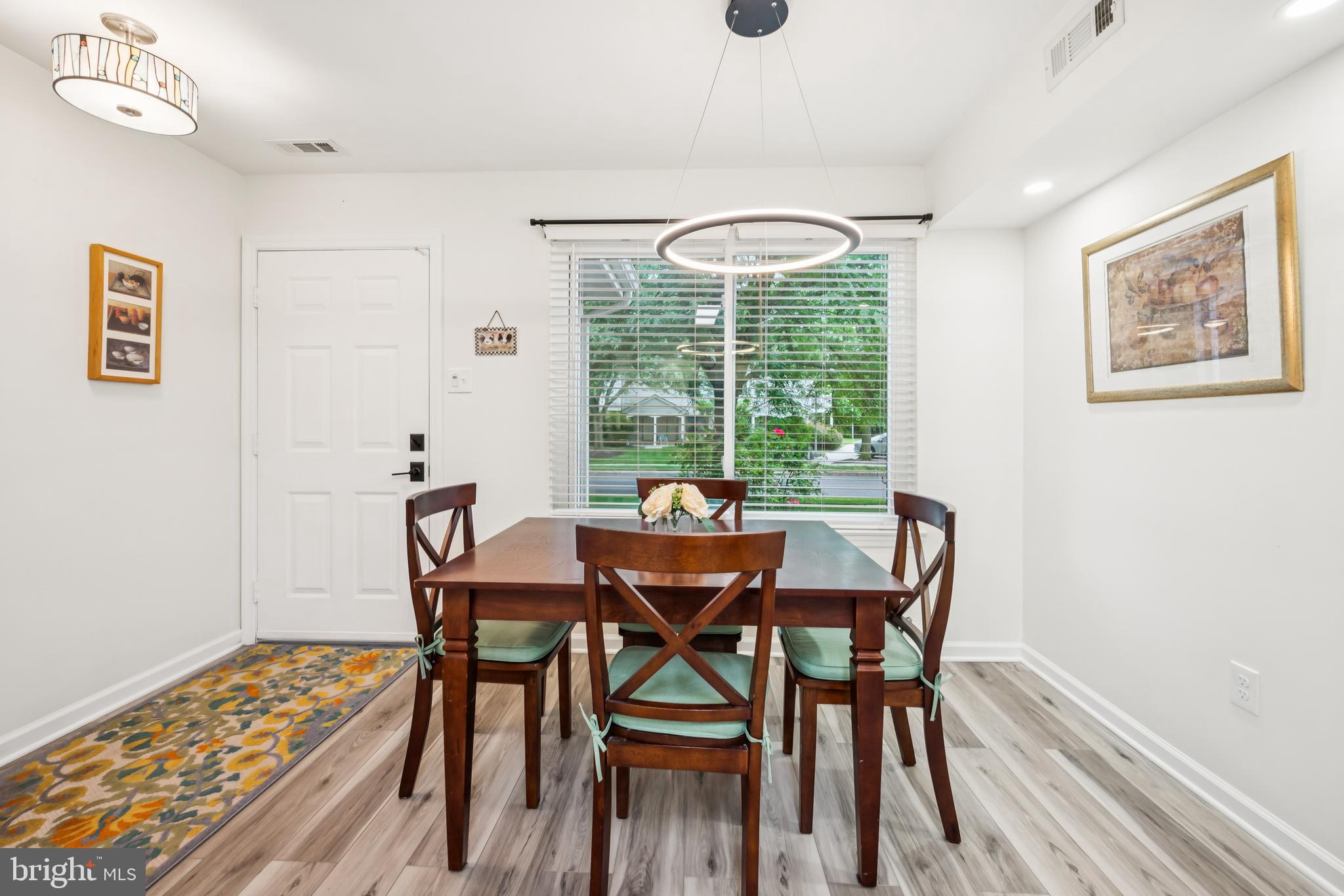 2004 Sandra Road Voorhees, NJ 08043 - Photo 7 of 25 a view of a dining room with furniture window and wooden floor