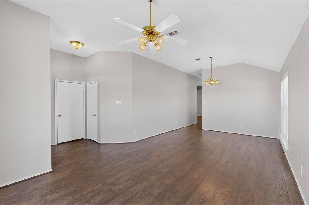 1025 Caleb Street Burleson, TX 76028 - Photo 9 of 38 Living view toward garage exit door and coat closet