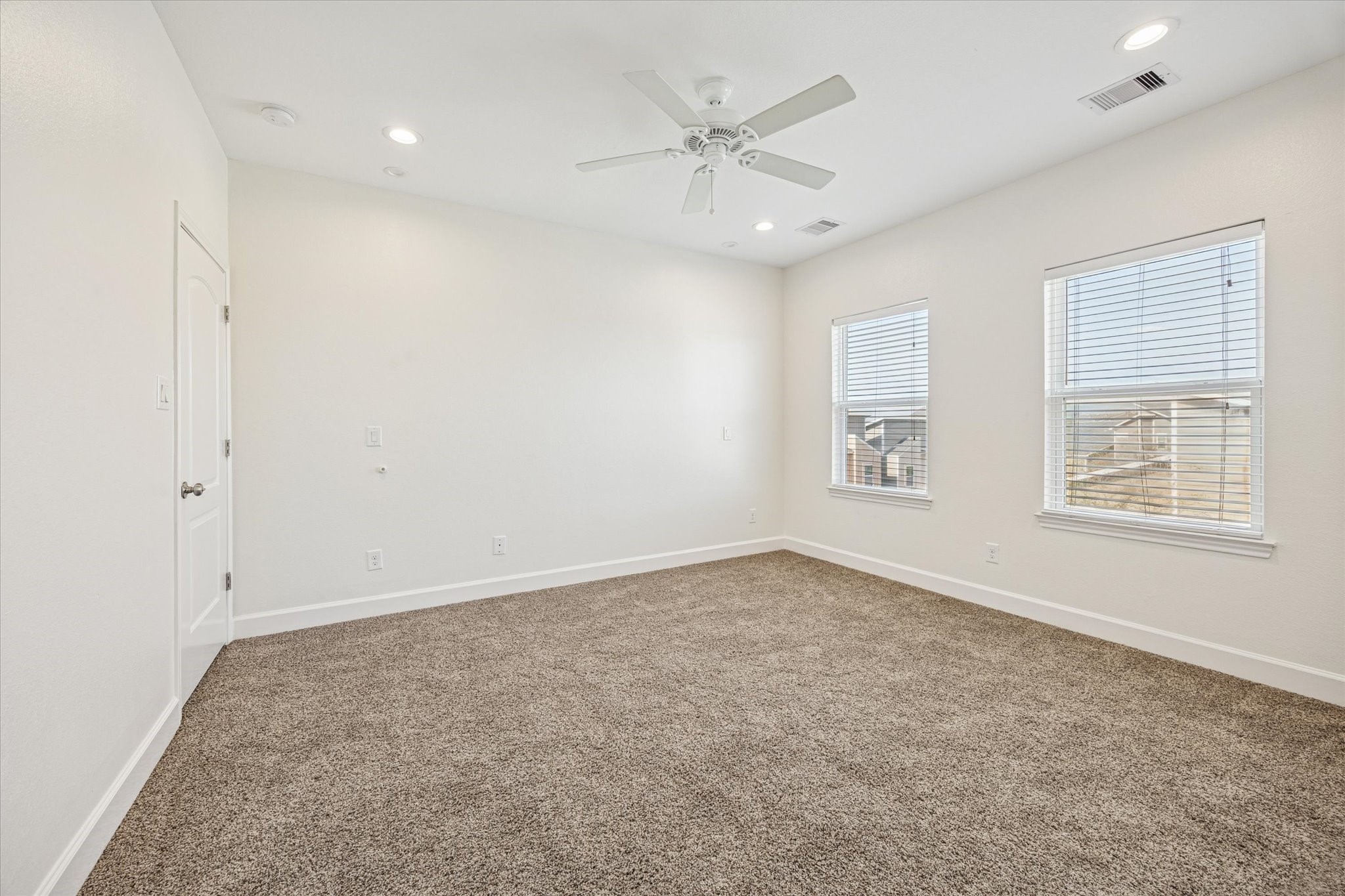 5402 Jonathan Lane Houston, TX 77011 - Photo 22 of 33 Secondary Bedroom on the Second Floor. Loads of light and new carpet (2025).