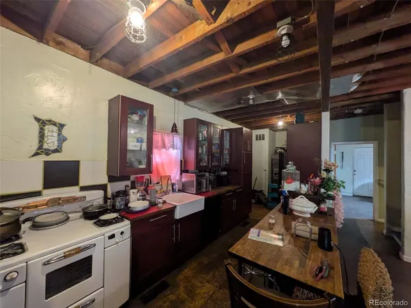 a view of a kitchen with a stove and a refrigerator