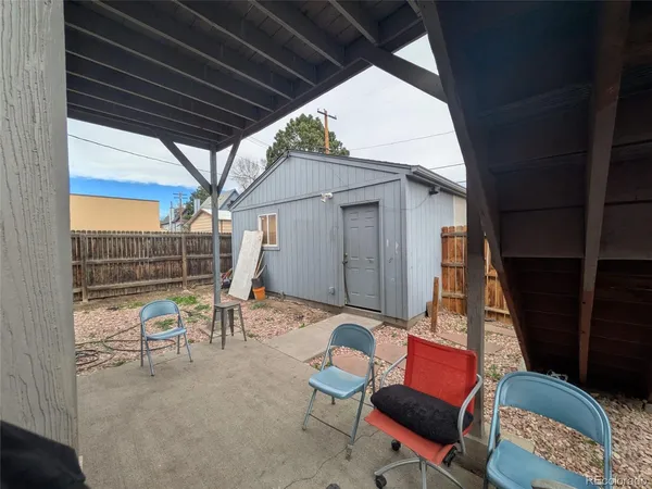 a view of a house with a wooden deck