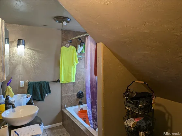 a bathroom with a sink and mirror