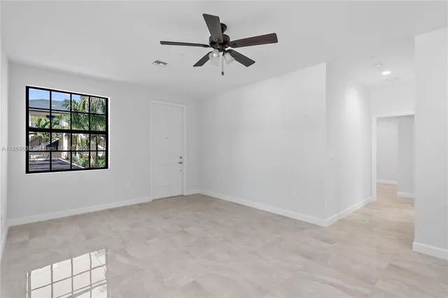 a view of an empty room with a window