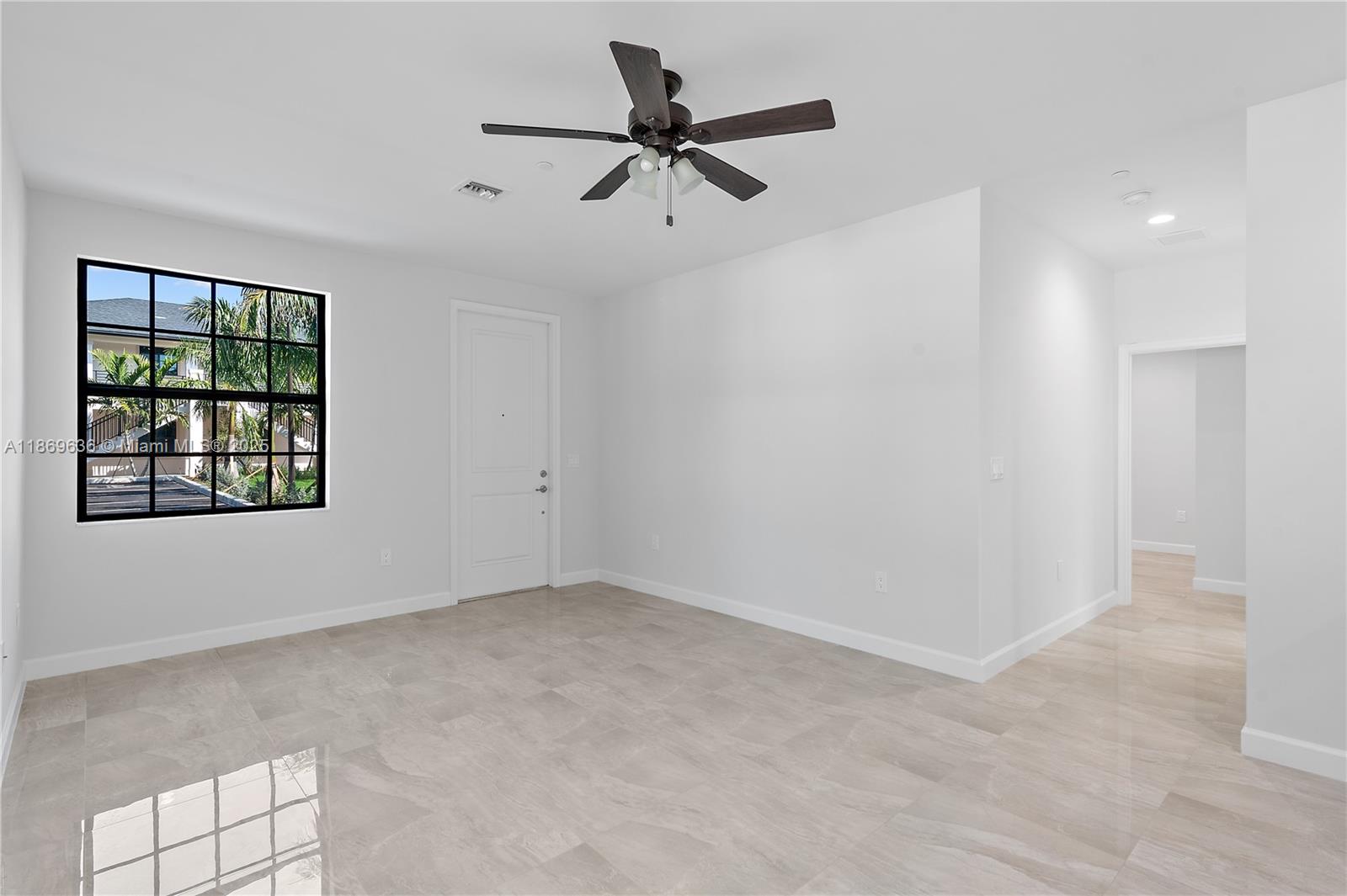 5750 Southwest 44th Street, Unit 201 Davie, FL 33314 - Photo 15 of 26 a view of an empty room with a window
