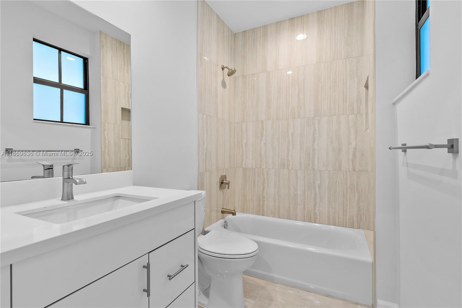 5750 Southwest 44th Street, Unit 201 Davie, FL 33314 - Photo 17 of 26 a bathroom with a sink a toilet and shower