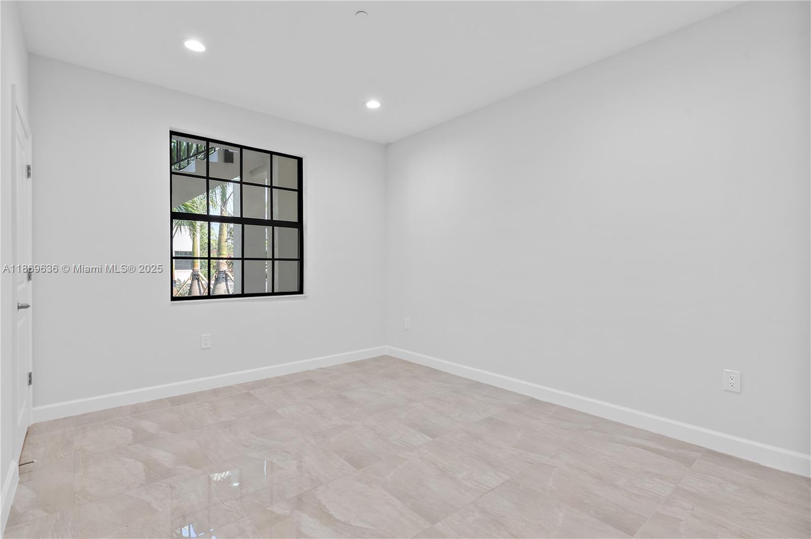 5750 Southwest 44th Street, Unit 201 Davie, FL 33314 - Photo 19 of 26 an empty room with windows