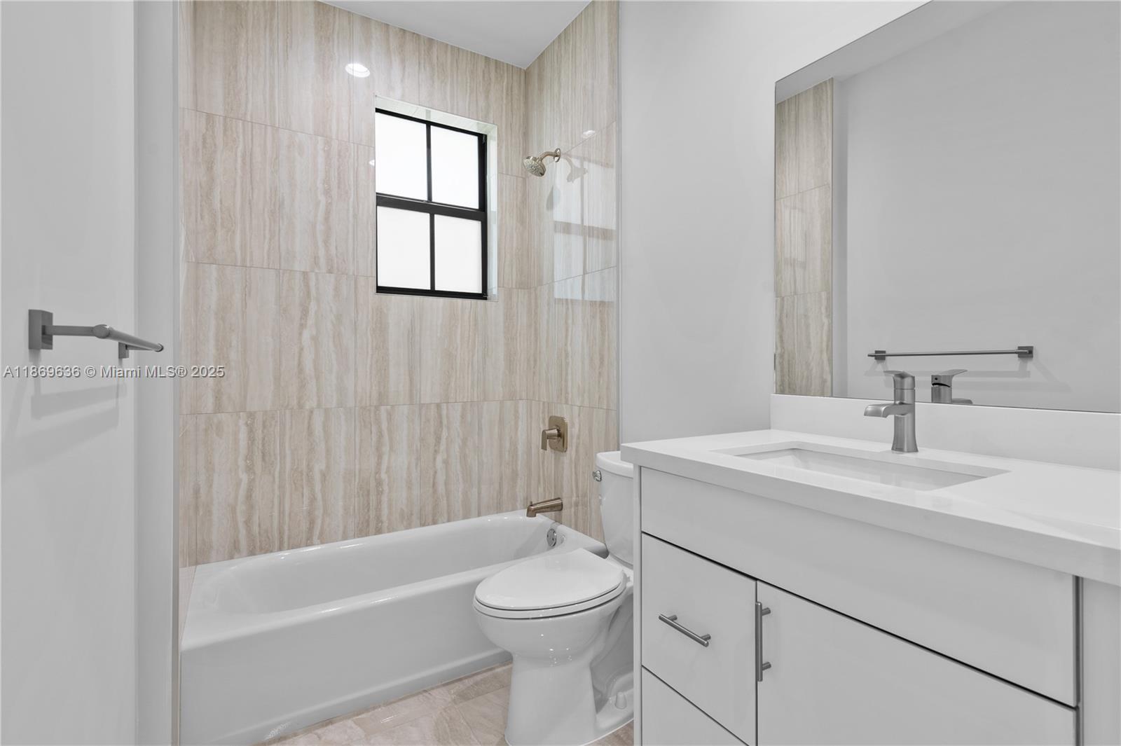 5750 Southwest 44th Street, Unit 201 Davie, FL 33314 - Photo 20 of 26 a bathroom with a sink a toilet and shower