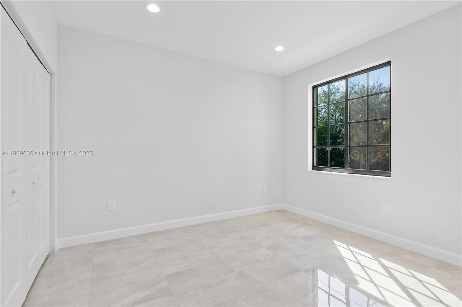 5750 Southwest 44th Street, Unit 201 Davie, FL 33314 - Photo 21 of 26 a view of an empty room with a window
