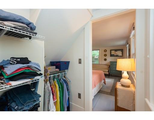 90 County Road Ipswich, MA 01938 - Photo 18 of 42 a view of walk in closet with clothes and shoes