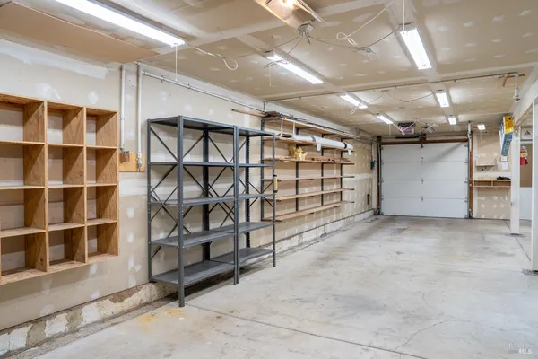 a view of an empty room with storage
