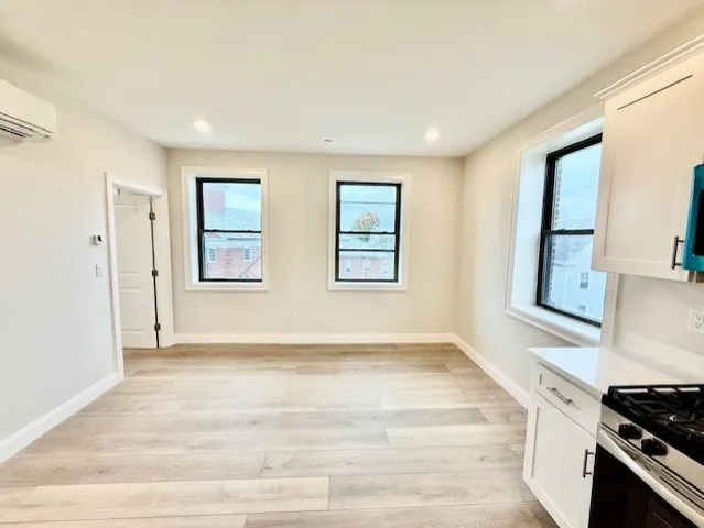 a view of an empty room with a window