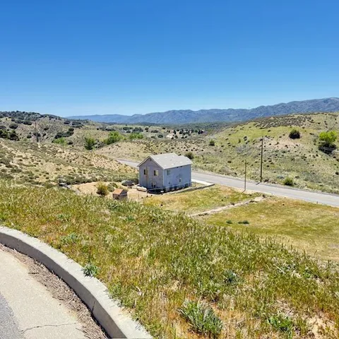 a view of a large body of water with a building in the background