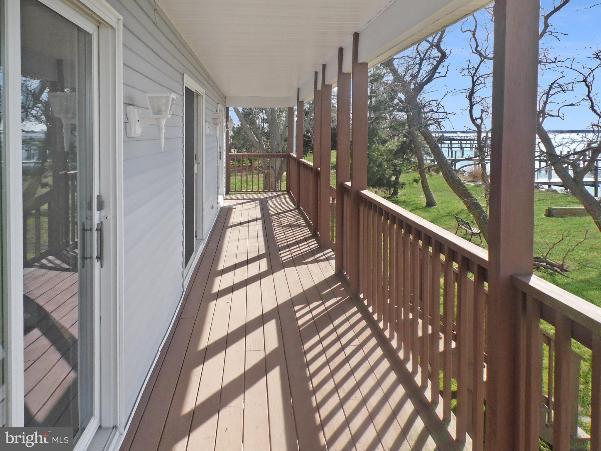 20138 Nanticoke Road Nanticoke, MD 21840 - Photo 14 of 29 Full length sunny, waterfront deck