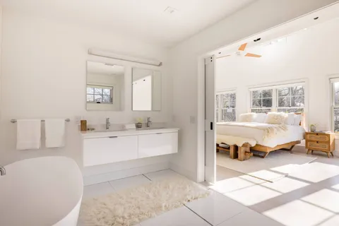 a spacious bedroom with a bed and a couch