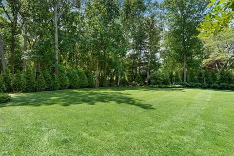 a view of outdoor space with deck and yard