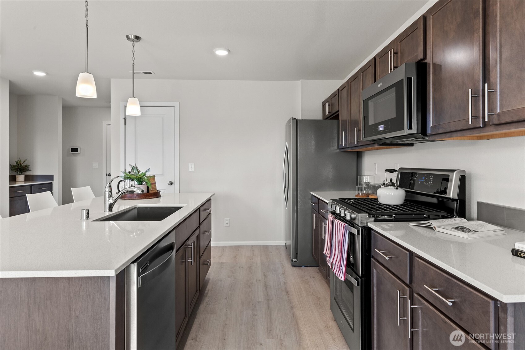 32302 135th Place Southeast Sultan, WA 98294 - Photo 17 of 32 a kitchen that has a sink and a stove