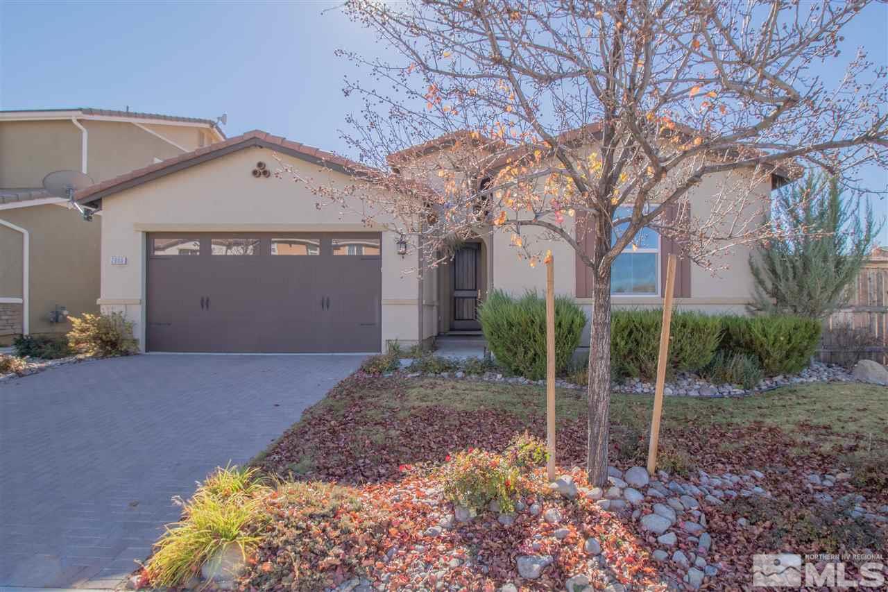 2000 Angel Ridge Drive Reno, NV 89521 - Photo 1 of 18 a view of a house with a yard and garage
