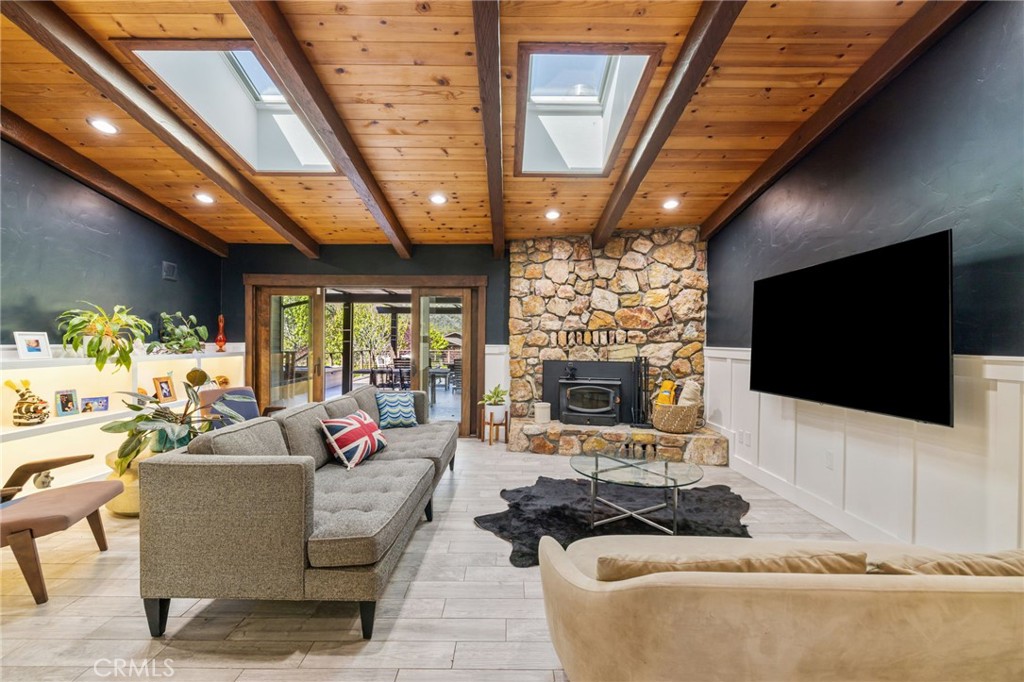 59353 Hop Patch Spring Road Mountain Center, CA 92561 - Photo 12 of 68 a living room with fireplace furniture and a flat screen tv