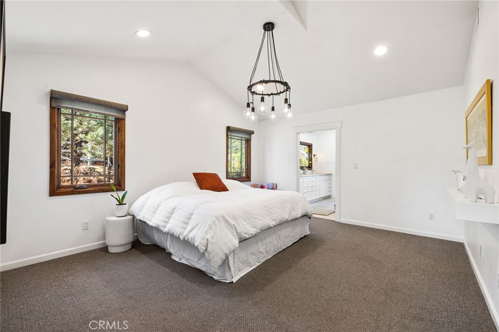 59353 Hop Patch Spring Road Mountain Center, CA 92561 - Photo 14 of 68 a spacious bedroom with a bed and a window