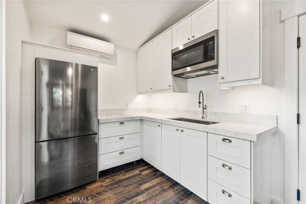 59353 Hop Patch Spring Road Mountain Center, CA 92561 - Photo 32 of 68 a kitchen with a refrigerator microwave and sink