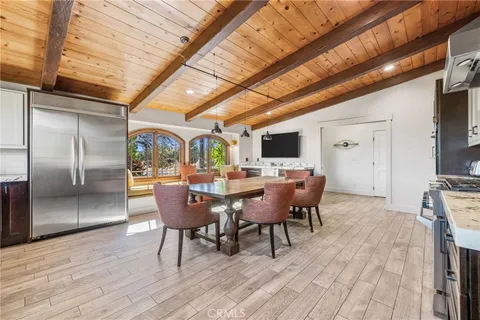 a kitchen with a refrigerator microwave and sink