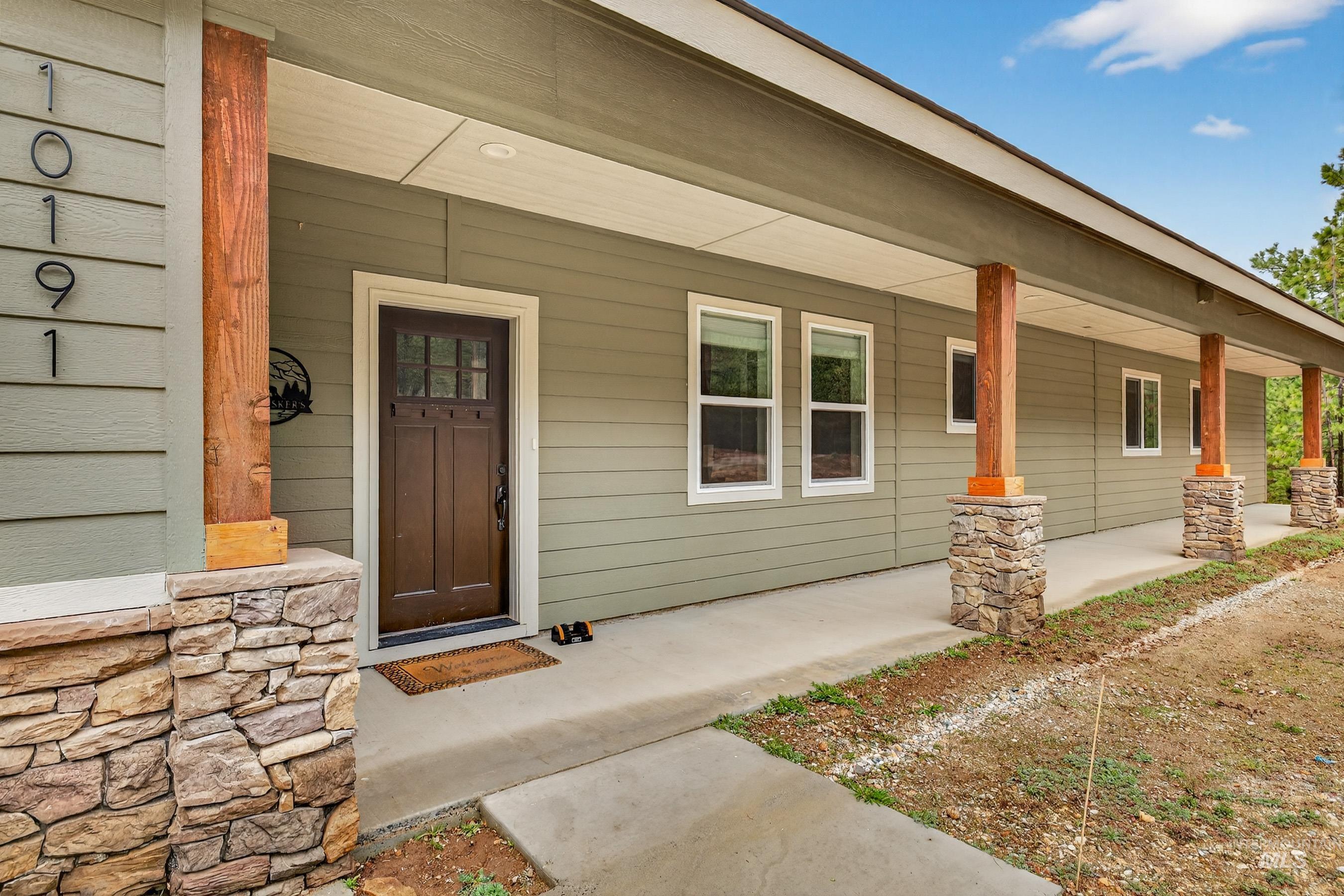 10191 Timberrim Drive Cascade, ID 83611 - Photo 9 of 44 Doorway to property featuring covered porch