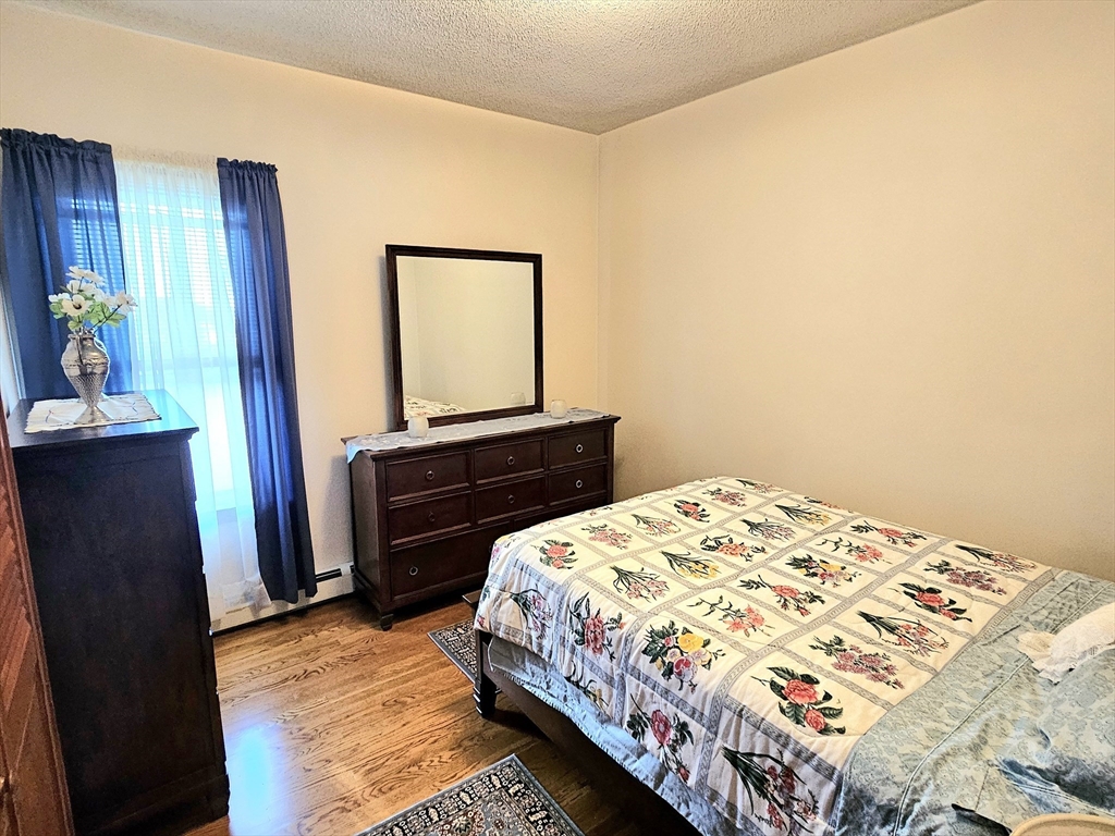 460 William Street Fall River, MA 02721 - Photo 11 of 23 a bedroom with a bed and a dresser