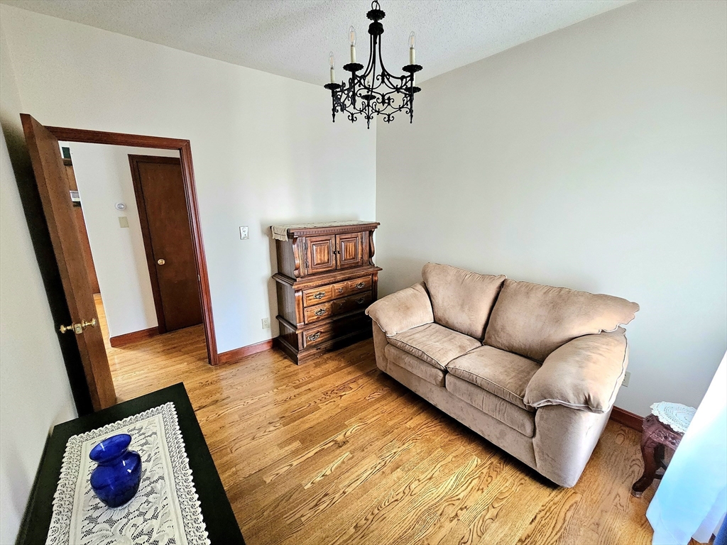 460 William Street Fall River, MA 02721 - Photo 12 of 23 a living room with furniture and a flat screen tv