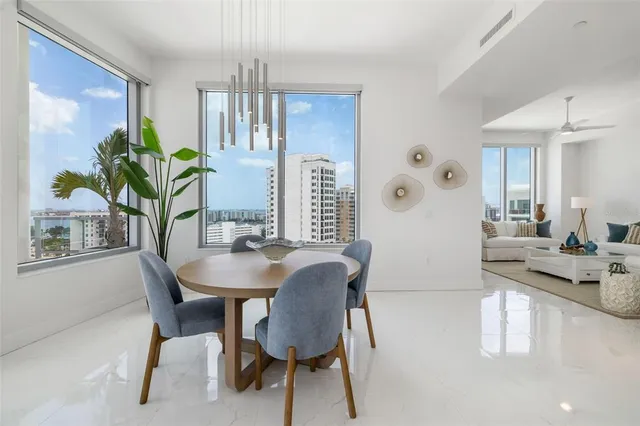 a bedroom with a bed and painting on the wall