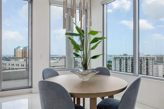 a spacious bedroom with a bed and a lamp