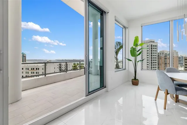 a bedroom with furniture and a potted plant