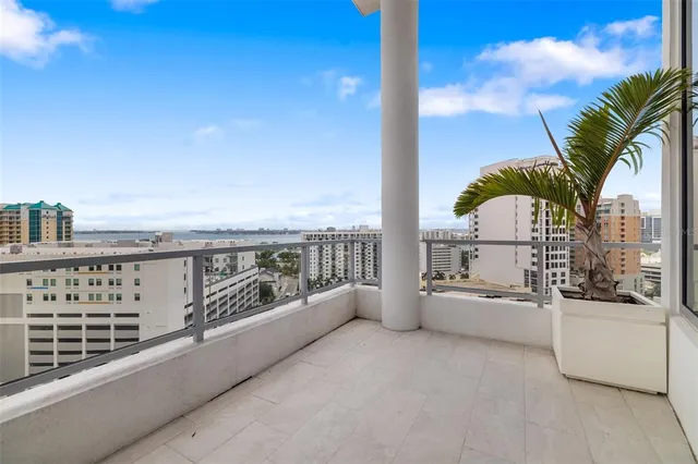 a bedroom with a large bed and a large window