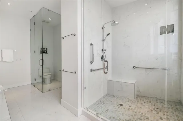 a view of living room with furniture and floor to ceiling window
