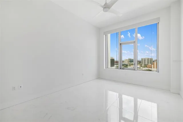 a view of a dining room with furniture and window