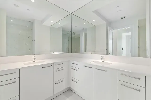 a kitchen with a stove and a white cabinets