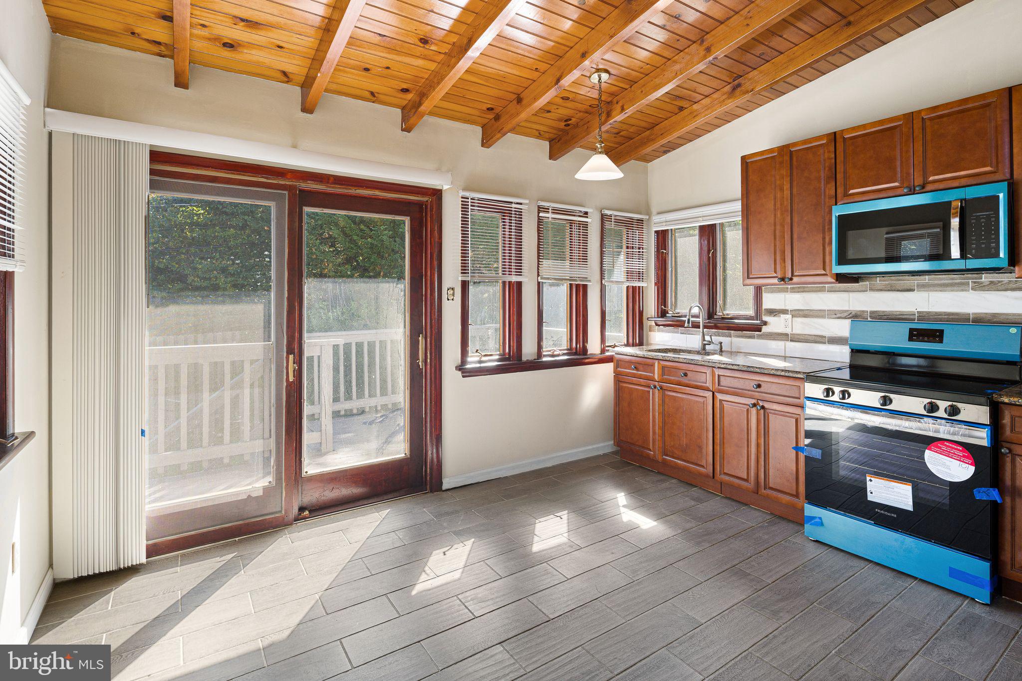 13 Rodney Road Bryn Mawr, PA 19010 - Photo 8 of 45 Kitchen w/ Vaulted Ceiling & Slider to Deck