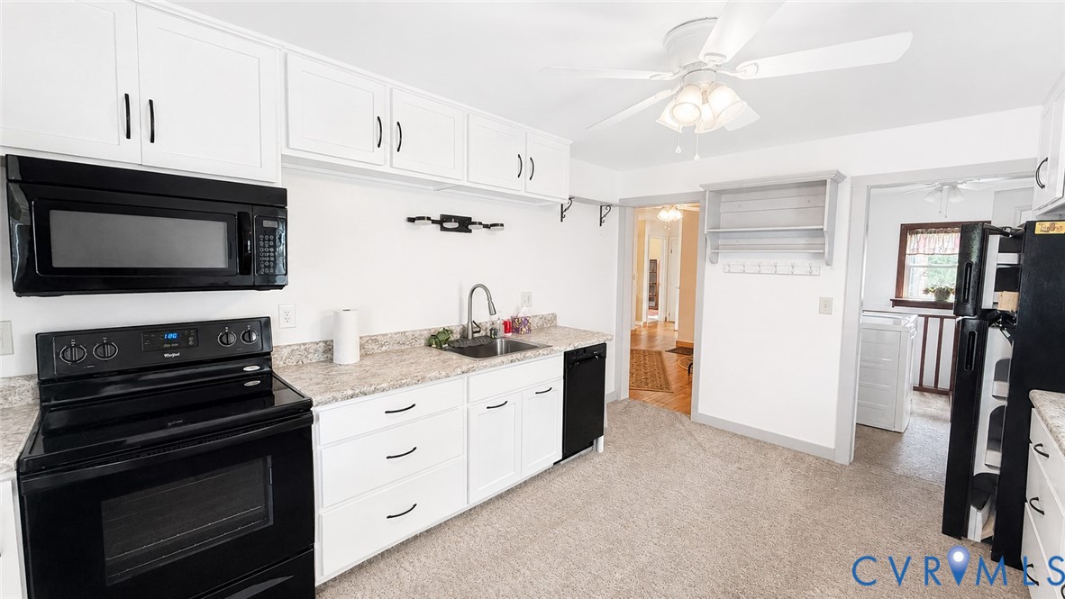 5560 West Hoover Road Reva, VA 22735 - Photo 20 of 32 Kitchen featuring white cabinetry with dark hardwa