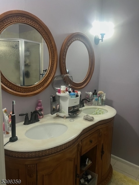 199 Hyde Park Road Somerset, NJ 08873 - Photo 11 of 17 a bathroom with a sink and a mirror