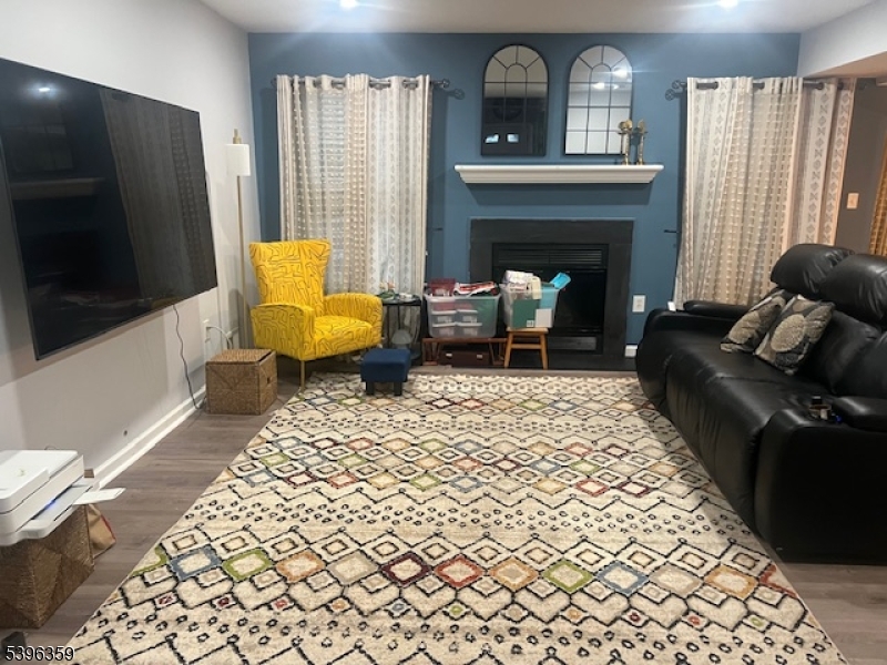 199 Hyde Park Road Somerset, NJ 08873 - Photo 2 of 17 a living room with furniture and a fireplace