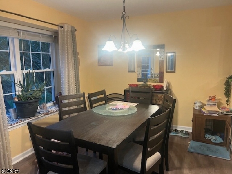 199 Hyde Park Road Somerset, NJ 08873 - Photo 7 of 17 a view of a dining room with furniture and wooden floor