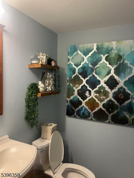 199 Hyde Park Road Somerset, NJ 08873 - Photo 9 of 17 a bathroom with a toilet and a sink