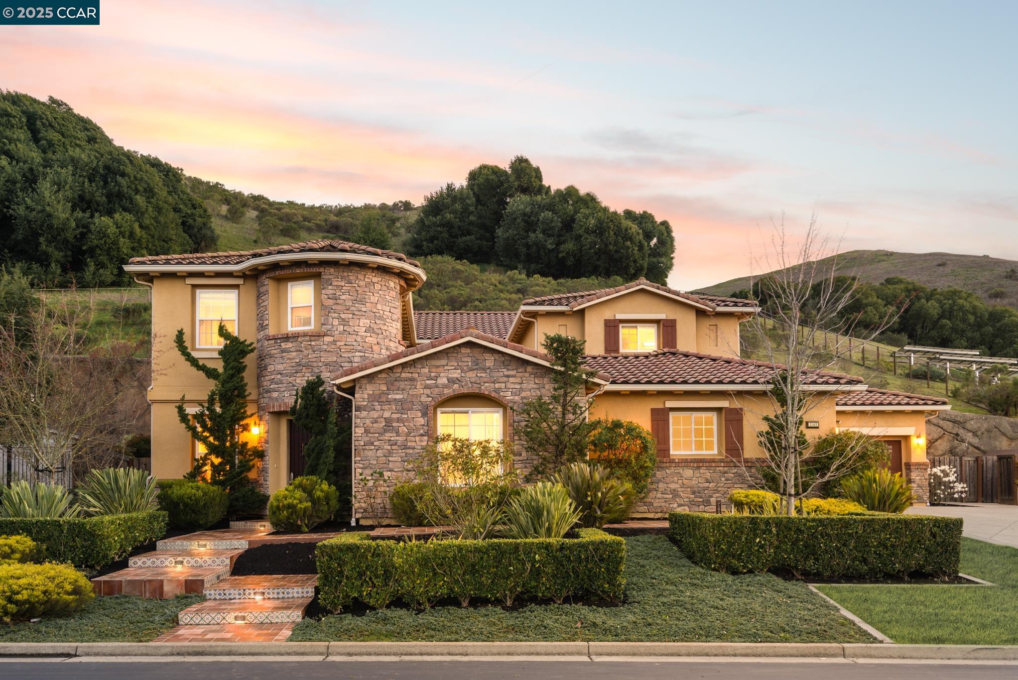 a front view of a house with a yard