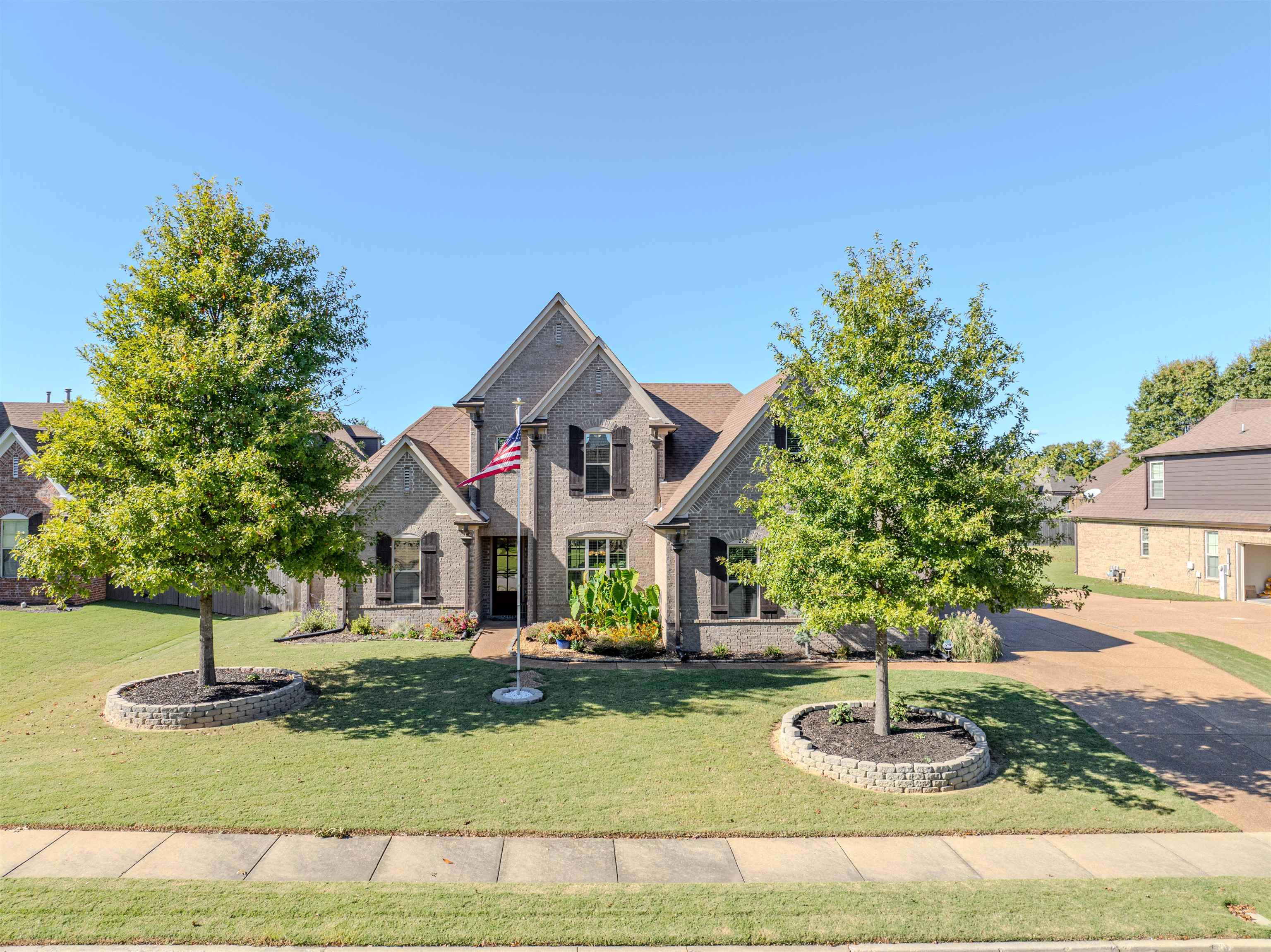 226 Estanaula Road Collierville, TN 38017 - Photo 1 of 32 a front view of a house with garden