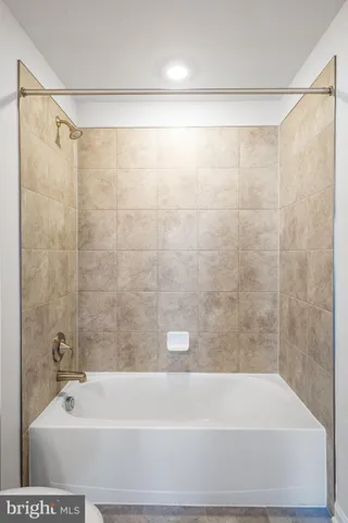 a bathroom with a shower and a bathtub