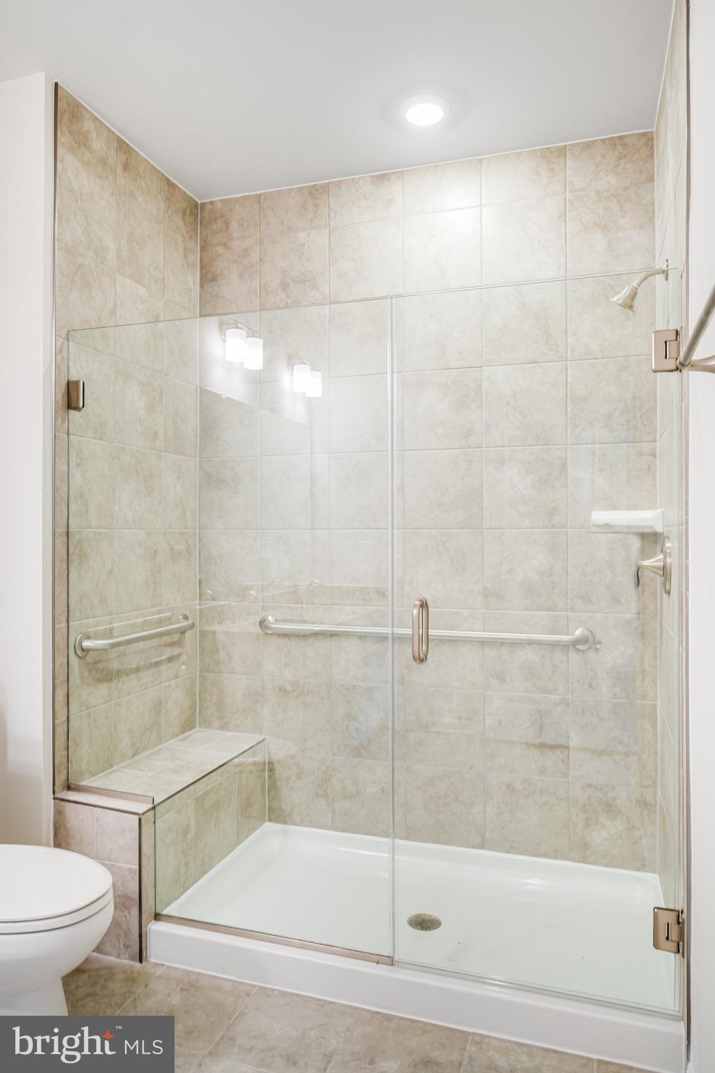 4003 Seaside Alder Road, Unit 203 Bowie, MD 20720 - Photo 21 of 22 a bathroom with a shower and a toilet
