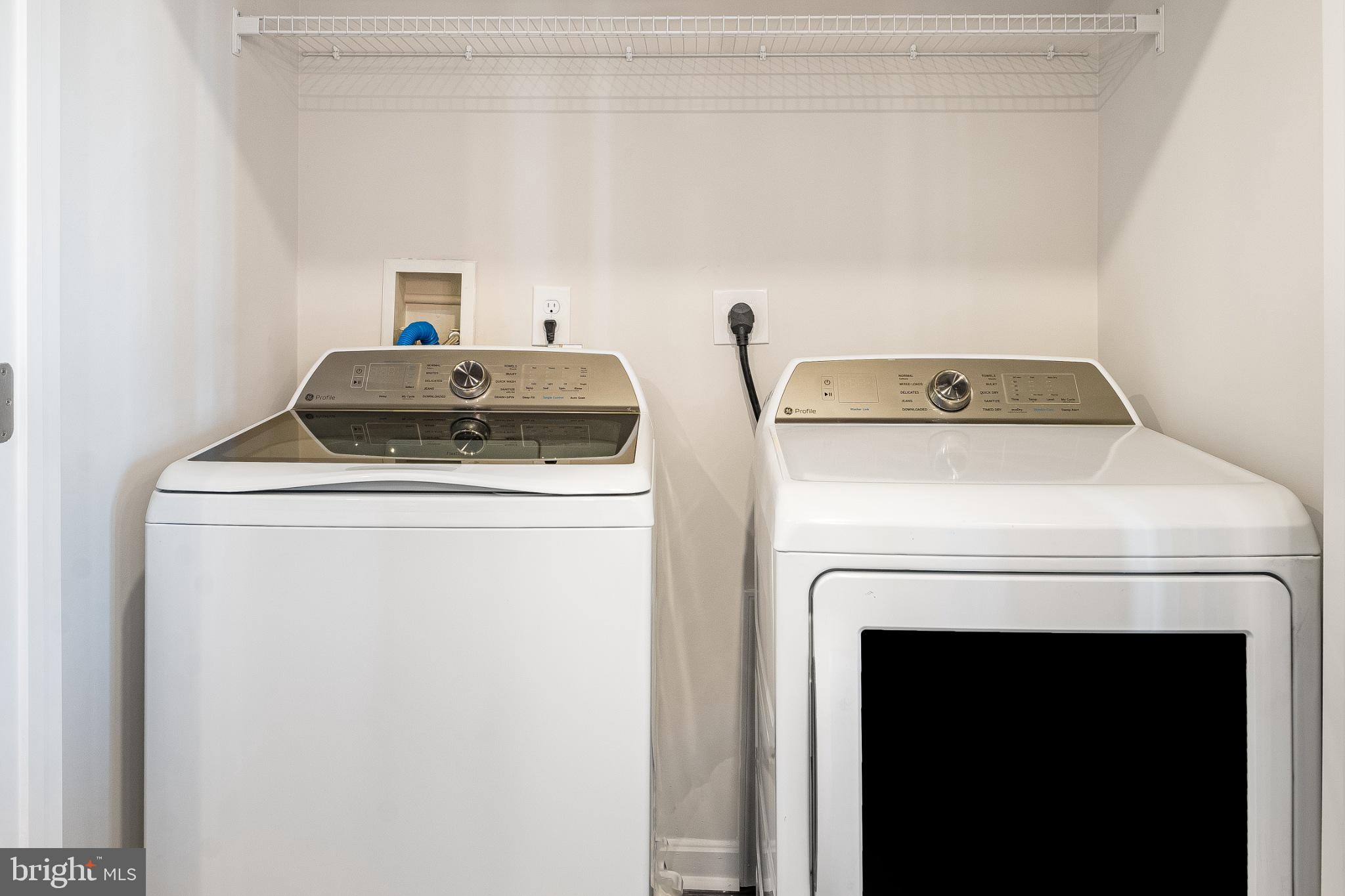 4003 Seaside Alder Road, Unit 203 Bowie, MD 20720 - Photo 8 of 22 a utility room with dryer and washer