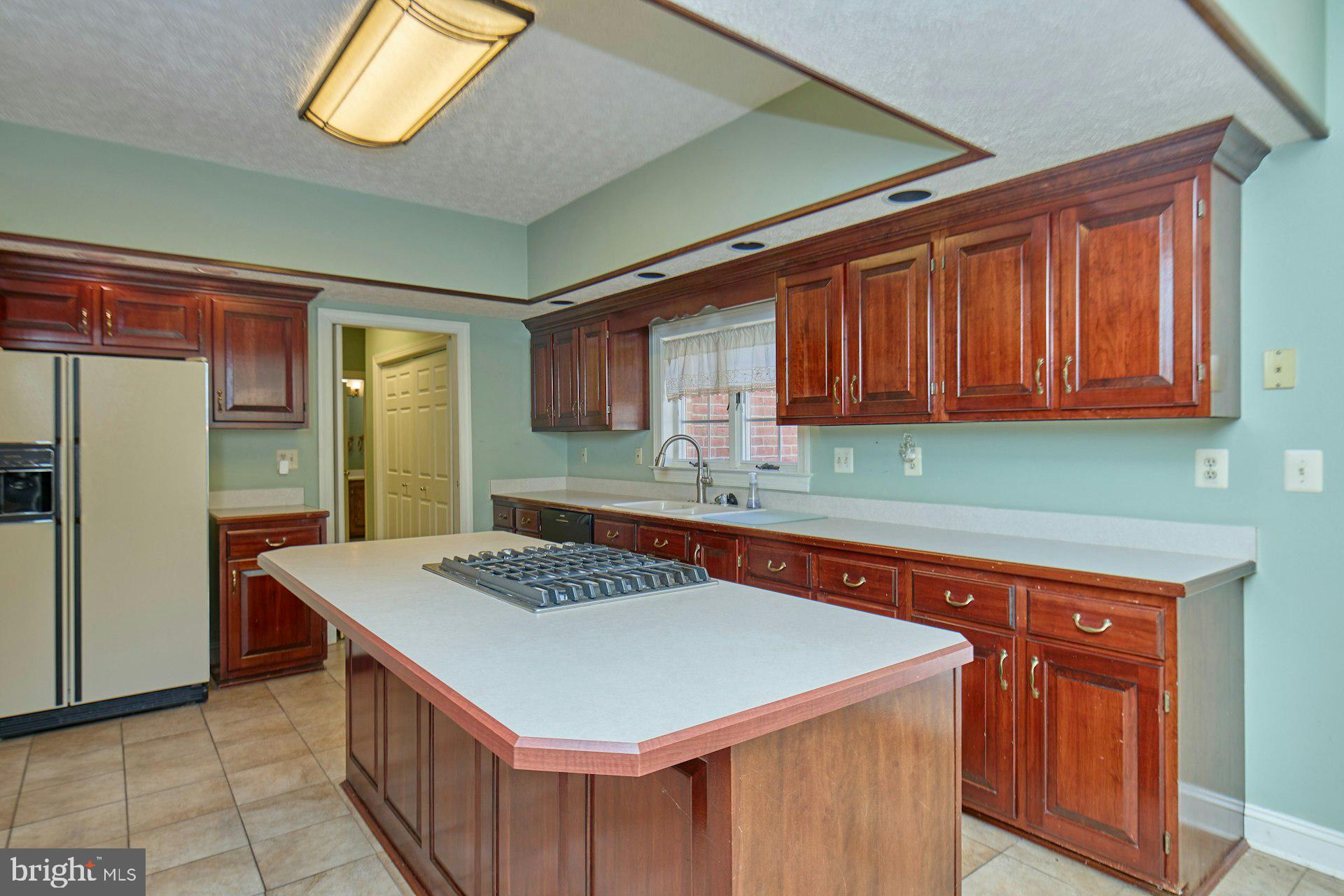 6051 Adams Drive La Plata, MD 20646 - Photo 16 of 72 a kitchen that has a cabinets and a stove