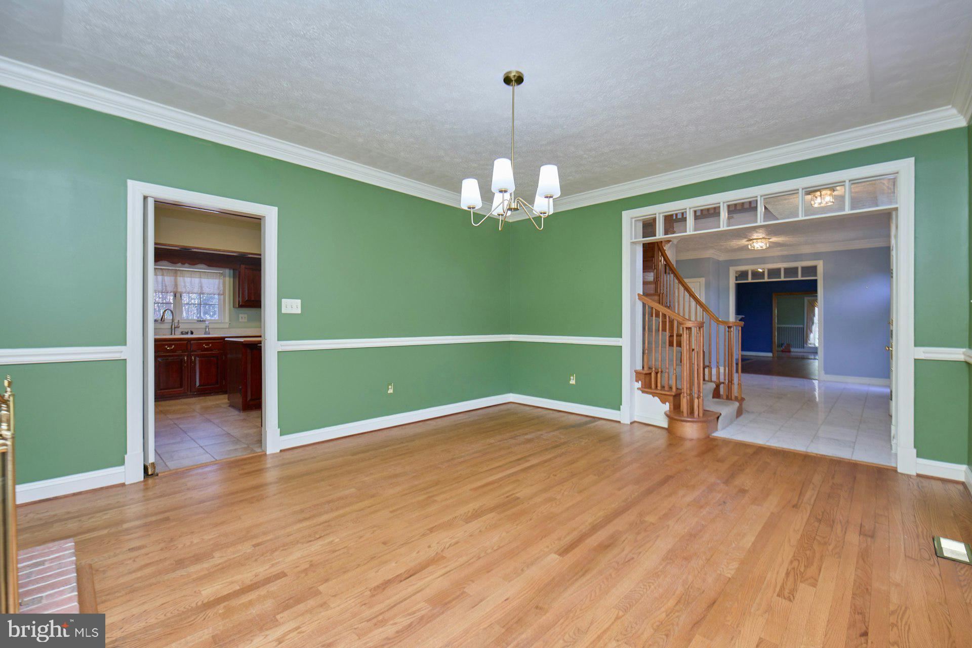 6051 Adams Drive La Plata, MD 20646 - Photo 21 of 72 a view of a room with wooden floor washing machine and a chandelier