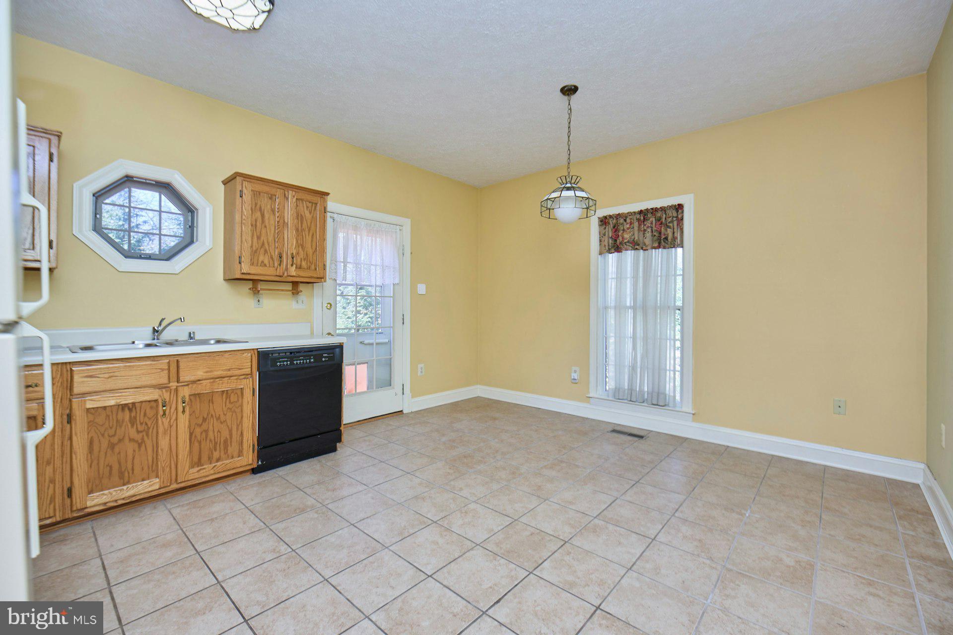 6051 Adams Drive La Plata, MD 20646 - Photo 28 of 72 a spacious bathroom with a granite countertop sink a mirror and a shower