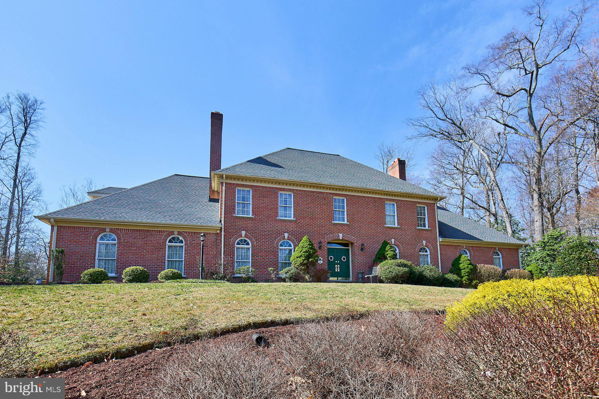 6051 Adams Drive La Plata, MD 20646 - Photo 4 of 72 a view of a brick house with a yard